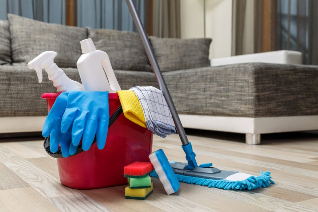Airbnb cleaning company preparing fresh bed linens for the next short-term rental guest.